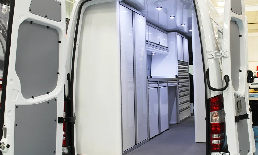 White Work Van With Side Door Open Showing White Cabinets
