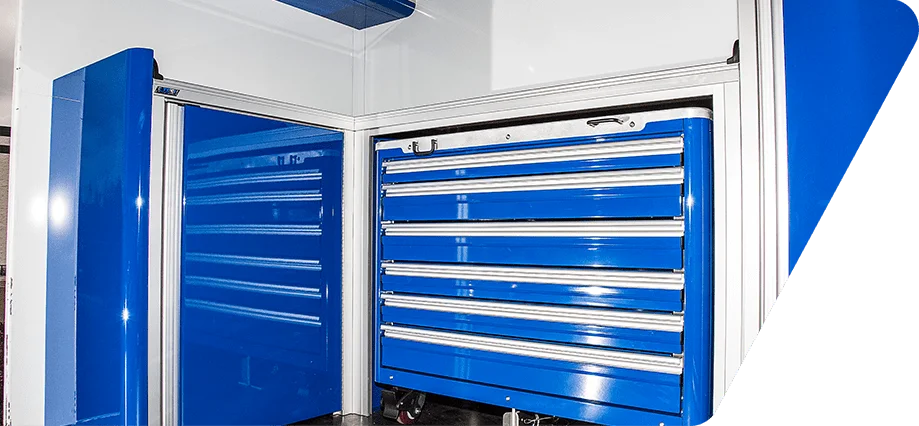Blue Caster Cart and Integrated Cabinets System in Cargo Trailer